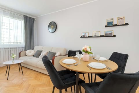 Modern living room arrangement, in which a comfortable sofa and decorative shelves form a harmonious whole.