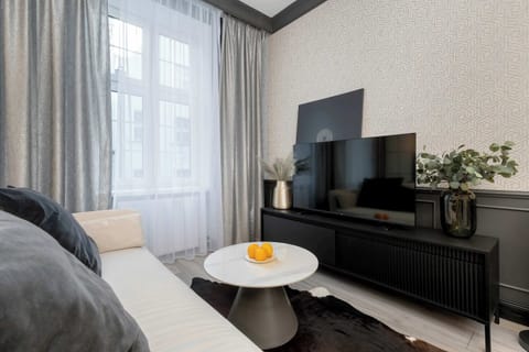 Enjoy your favorite shows on the flat-screen television in the elegant living area.