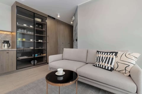 Living room with a comfortable sofa and TV. 