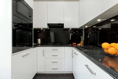 Compact, modern kitchen space for quick preparation of essential meals.