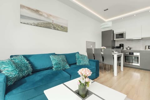 Spacious living room and kitchenette in an open space allowing full relaxation.