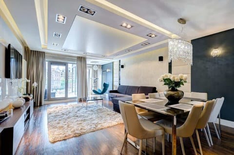 Contemporary dining area with elegant chairs and large windows bringing in natural light.