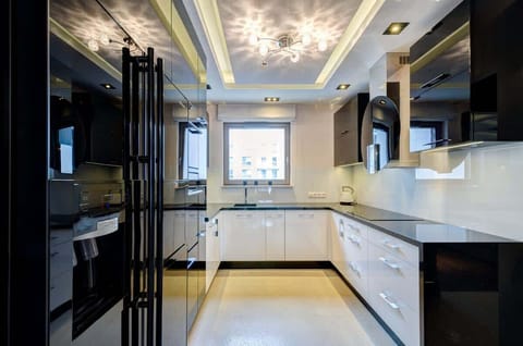 State-of-the-art black kitchen with premium appliances and sleek design.