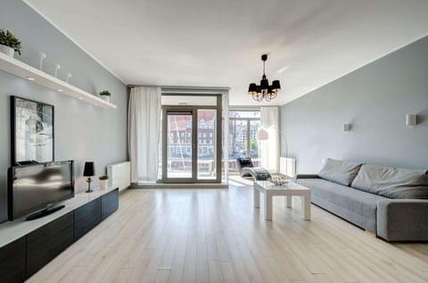 A cozy living area featuring a stylish coffee table, soft seating, and minimalist decor. Ideal for unwinding after a long day.