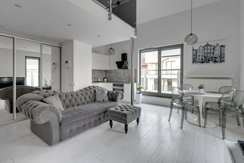 A spacious and elegant living room with luxurious furniture, ideal for relaxing.