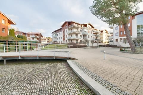 A modern residential area surrounded by greenery, designed for comfort and relaxation.