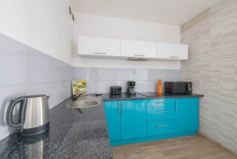 Equipped with modern appliances such as a stovetop, microwave, fridge, electric kettle, dishwasher it meets every guest's expectations.