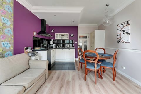 The living room offers guests a comfortable sofa to relax after a long day.