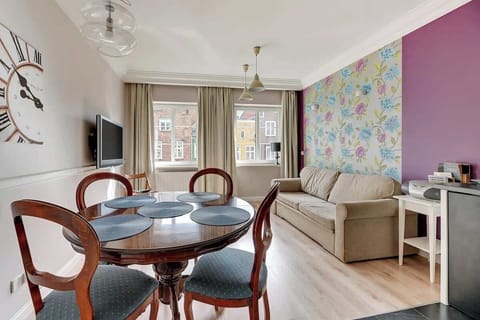 Cozy interior in muted colors with a traditional dining table.