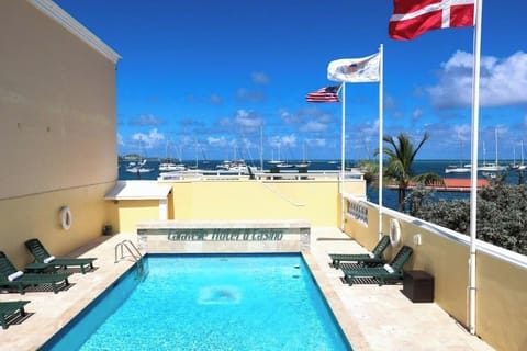Dive into the rooftop pool with sweeping ocean views.