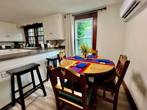Eating/game table with air conditioning/heating unit
