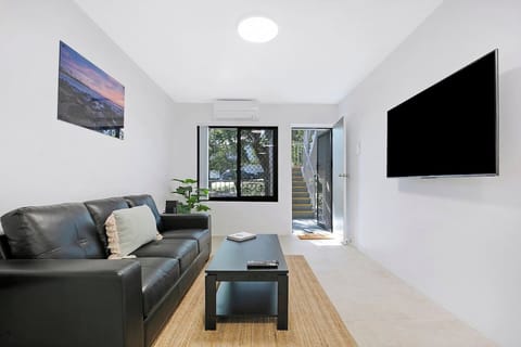 Stretch out on the leather sofa and enjoy your favourite shows on the TV, all in the comfort of the air-conditioned living area—perfect for unwinding after a day out in Brisbane.