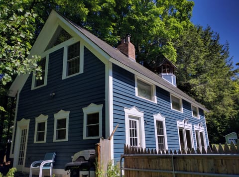 exterior with bell tower in the back. Copper roof. 