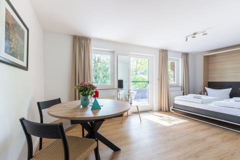 Bright Bedroom with Table and Bed