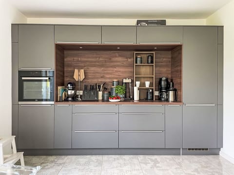 Kitchen Appliance, Kitchen, Cabinetry, Furniture, Flooring, Interior Design, Wood, Countertop, Home Appliance, Major Appliance