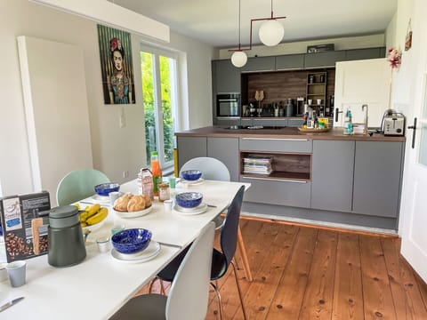 Kitchen, Kitchen Appliance, Countertop, Furniture, Interior Design, Flooring, Major Appliance, Cabinetry, Wood, Home Appliance