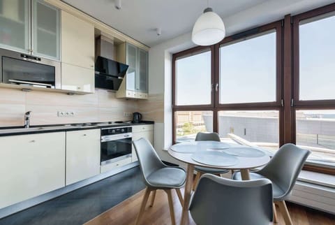  A close-up of the modern kitchen, complete with high-end appliances and ample counter space for culinary activities.