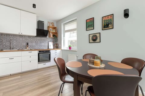 A stylish dining area next to the kitchen makes shared cooking and dining a breeze.