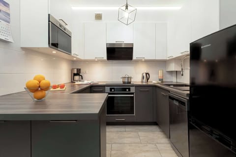 The kitchen has been designed in a modern and stylish style.