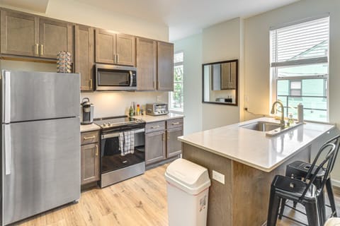 Modern kitchen design effects, gold tone fixtures, soft close cabinets & drawers