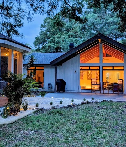 Serene private backyard with screened in Jacuzzi