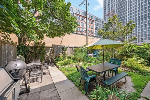 Back garden - gas and charcoal grills as well as a fire pit.