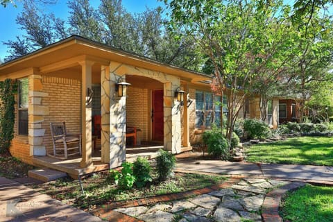 Inviting front porch welcomes you to your historic stay on Sayles!
