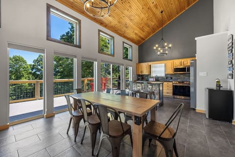 Share meals and memories around the spacious dining table with mountain views.