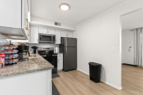Bright kitchen and entryway area with modern finishes and easy flow into the rest of the home.