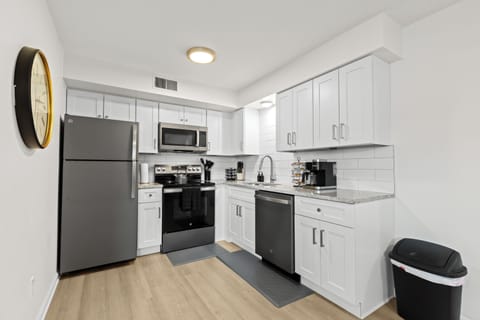 Bright and modern kitchen with spacious countertops, ideal for meal prep or entertaining.