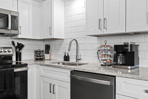 Updated kitchen with sleek finishes, full-size appliances, and coffee essentials ready for your stay.