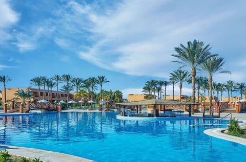 Dive into sparkling lagoon pools framed by palm-lined serenity.