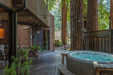 Soak under the stars, nestled between modern architecture and ancient redwoods.

