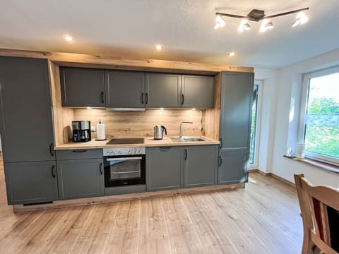 Wood, Flooring, Countertop, Kitchen, Furniture, Interior Design, Cabinetry, Floor, Kitchen Appliance, Ceiling