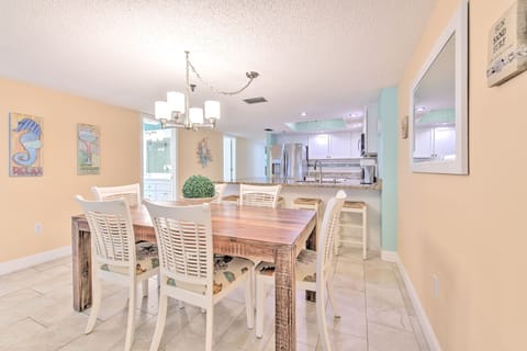 Gather around your spacious dining table where beach-themed artwork and coastal colors create the perfect setting for memorable meals together.