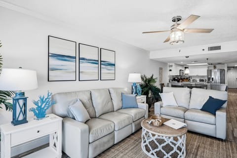 Relax in your bright living space with coastal touches and comfortable seating, where ocean-inspired decor creates a peaceful retreat.