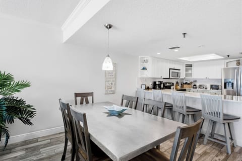 Your spacious dining area flows seamlessly into the modern kitchen, perfect for family meals and entertaining guests together.