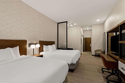 Stretch out with two plush beds in a bright, airy room.