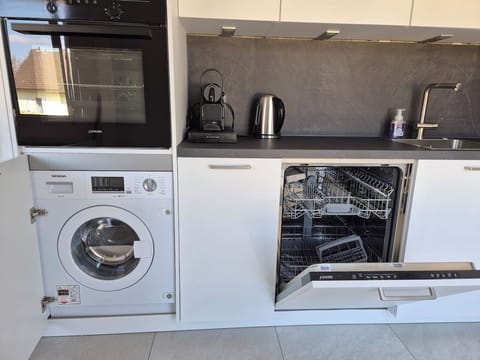 In the kitchen there is a dishwasher, a washer/dryer combination, coffee maker (Nespresso), kettle, oven, microwave, fridge and induction stovetop