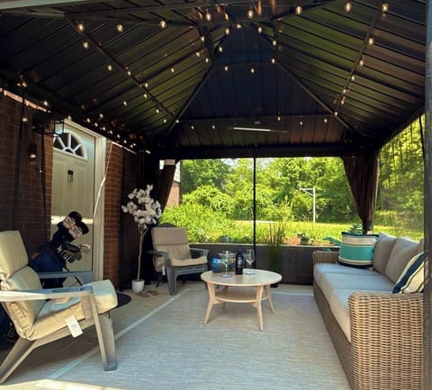 gazebo with led lights, patio with furniture, private entrance, mosquito net, fenced yard
