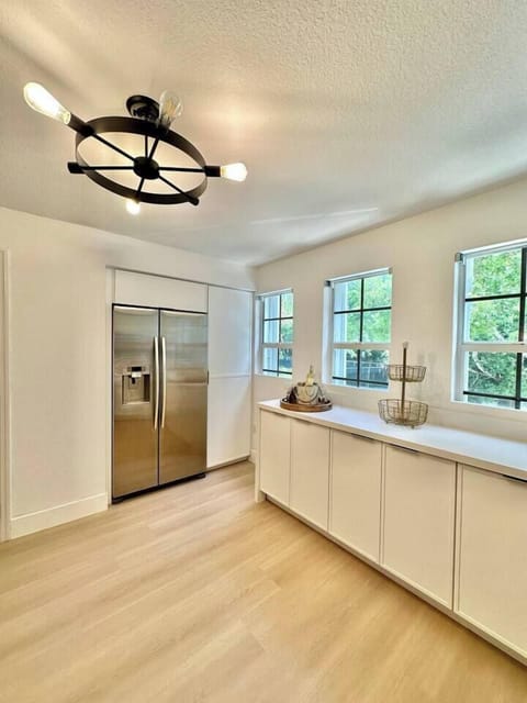 Tons of counter space, natural light, and a large fridge to keep everything cool and ready to go.