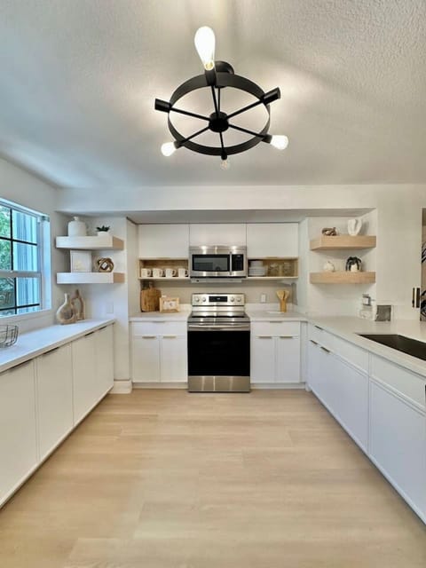 Modern kitchen with stainless steel appliances and all the space you need to cook or just hang out.