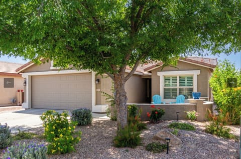 Shaded front yard with front patio and chairs
