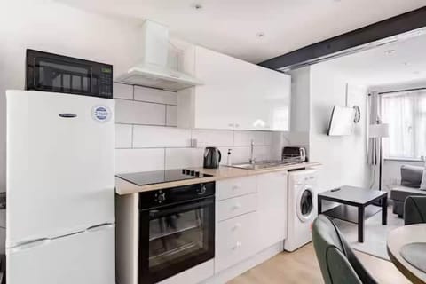 Modern fully-equipped kitchen with sleek appliances, ready for cooking family meals.