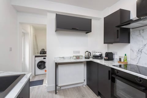 Chic cooking space with all the tools, plus a utility area to keep things fresh