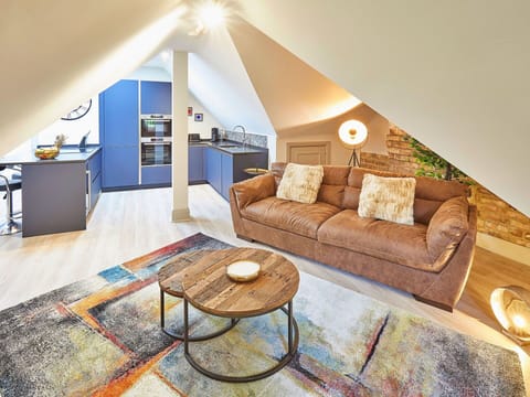 Furniture, Interior Design, Flooring, Wood, Floor, Ceiling, Couch, Room, Living Room, Lighting