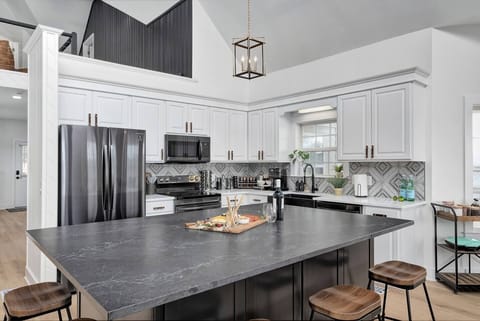 Custom island, which seats five guests and has plenty of room for a full dinner for all of your guests.