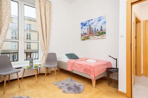Two comfortable single beds in the living room.