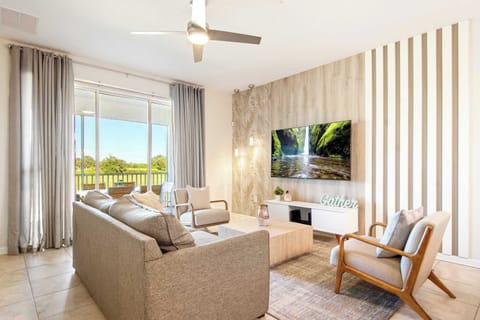 Airy, modern lounge with wood paneling, chic furniture, and patio view.