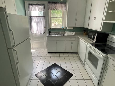 Kitchen leading to deck and large backyard